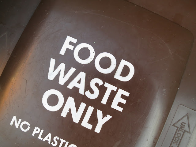 Top of a brown plastic bin for food waste.