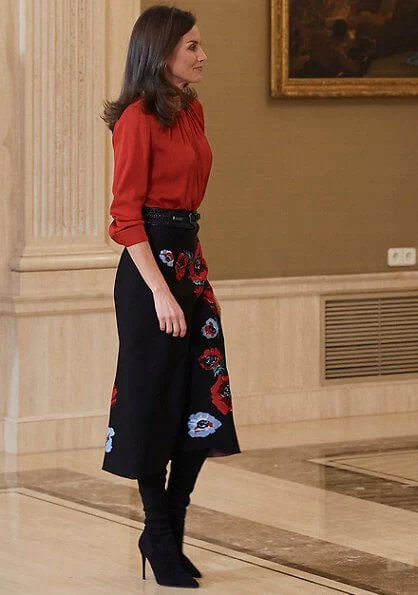 Queen Letizia wore Hugo Boss Banora red gathered neck silk blouse and Carolina Herrera black poppy-print knit skirt, gold diamond earrings