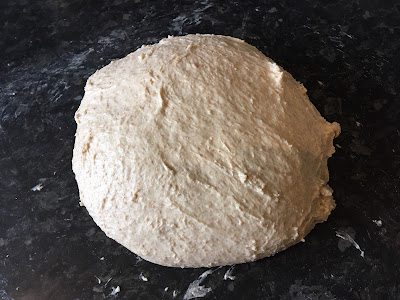 A wet looking piece of dough