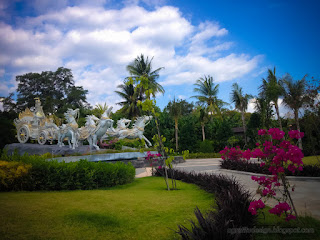 Beautiful Atmosphere Of Garden Park With Krishnas Chariot Statue In The Sunny Windy Afternoon At Tangguwisia Village North Bali Indonesia