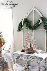 Grain sack stockings hung from wire rack Christmas tree style by Rusty Hinge featured at I Love That Junk #12daysofchristmas