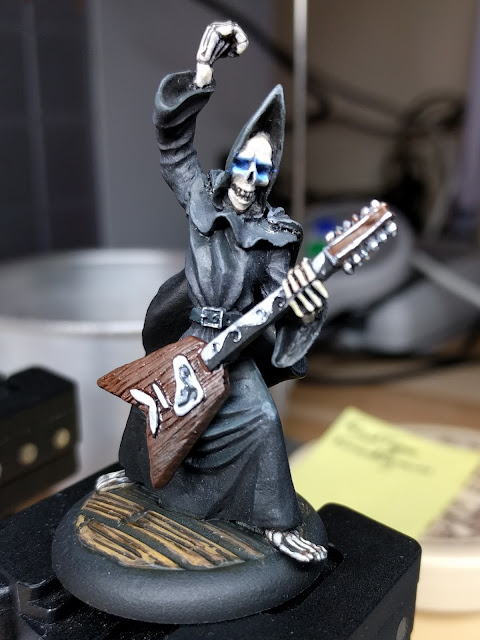 The eyes are hand painted... OSL is easier with an airbrush but with something this small - it\'s better to go with a brush. Death playing guitar fully painted