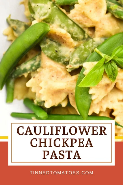 An incredibly easy creamy pasta sauce made with roasted cauliflower and chickpeas and served with green vegetables for a nice contrast.