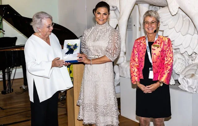 Crown Princess Victoria wore a new leaf patterned midi dress by Valerie. Princess Christina. Kreuger Jewellery feather earrings