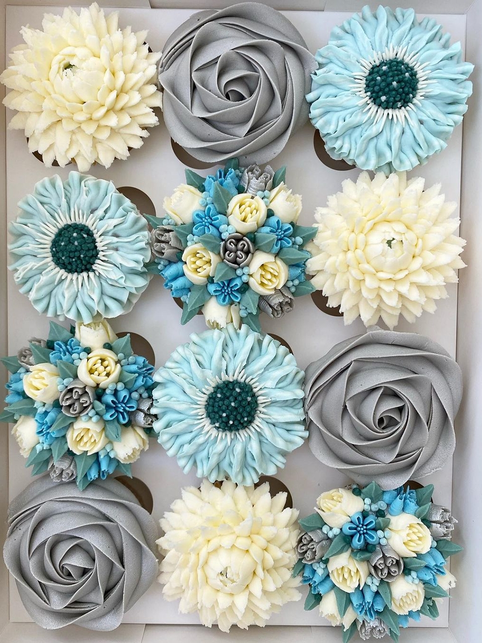 Beautiful buttercream flower topping on cupcakes by Kerry's Bouqcakes