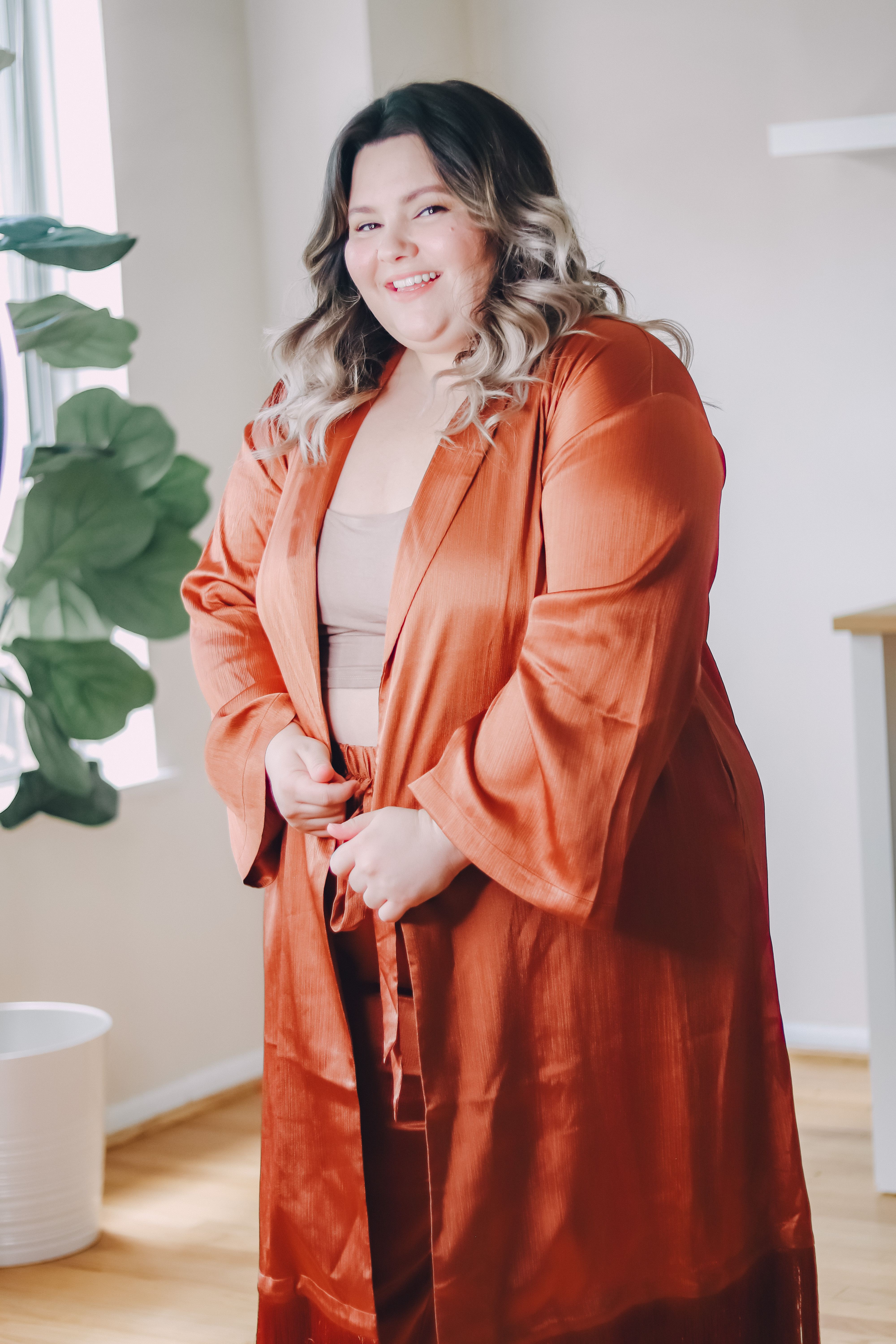 Petite plus size fashion blogger Natalie in the City, reviews Eloquii's loungewear, satin drawstring pants and satin duster. 
