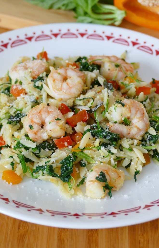 This simple and tasty lunch or dinner idea is packed full of delicious vegetables, fresh basil, garlic and lemon pepper along with the shrimp, orzo, parmesan cheese, bell pepper and spinach! It's ready in less than 30 minutes and you can omit the shrimp to make it completely meatless!