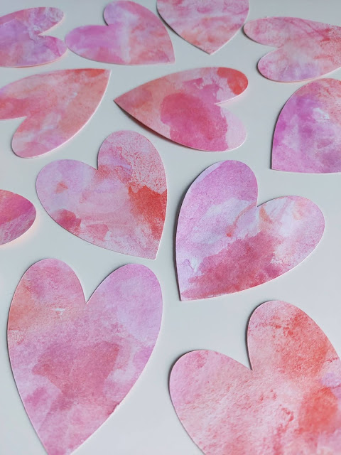 Make easy watercolour hearts with your children as Valentine's crafting.  You can use them as hanging decorations on a Valentine's tree.