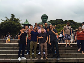 Yu Suzuki with the Japanese Dinner reward backers at the Great Buddha in Kamakura.