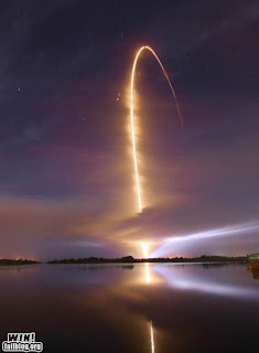 space shuttle lift off fiery vapour trail