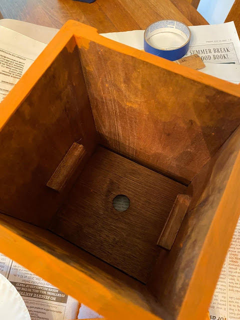 Photo of the inside of a wooden canister
