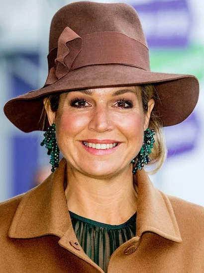 Queen Maxima wore Camel coat, Natan earrings, Lk Bennett boots, Fabienne Delvigne hat, Natan Skirt