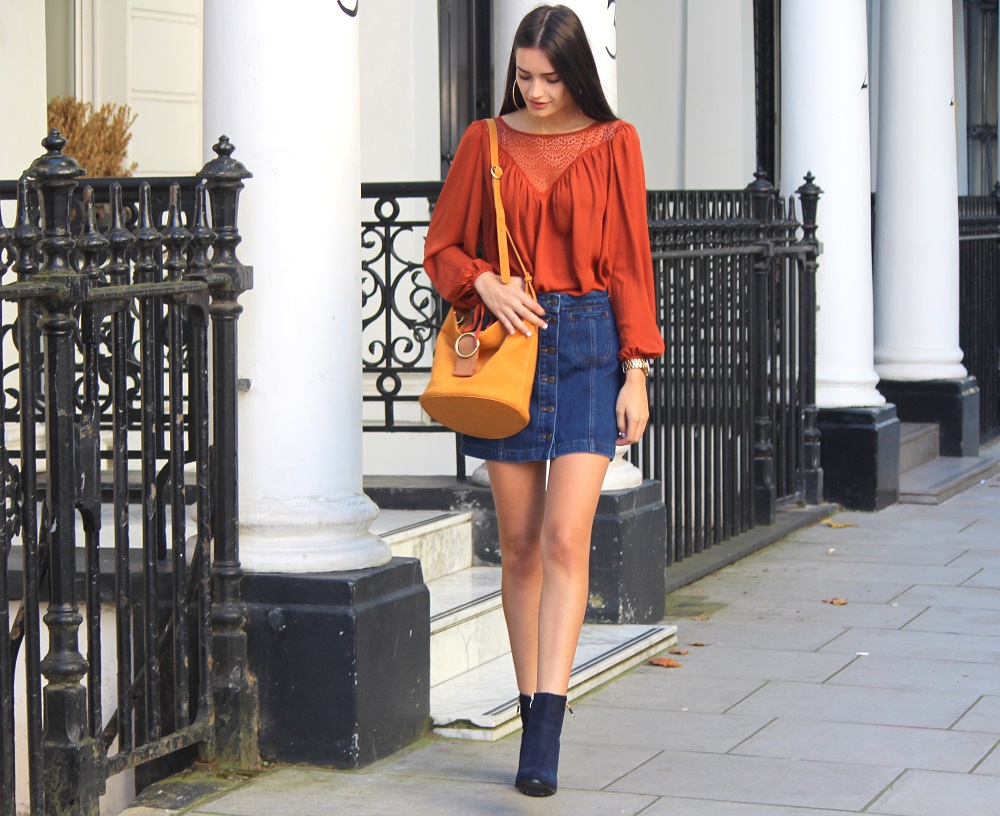 peexo fashion blogger wearing rust boho top and denim a line skirt autumn