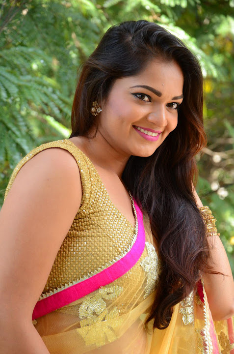 Ashwini Cleavage in Yellow Saree