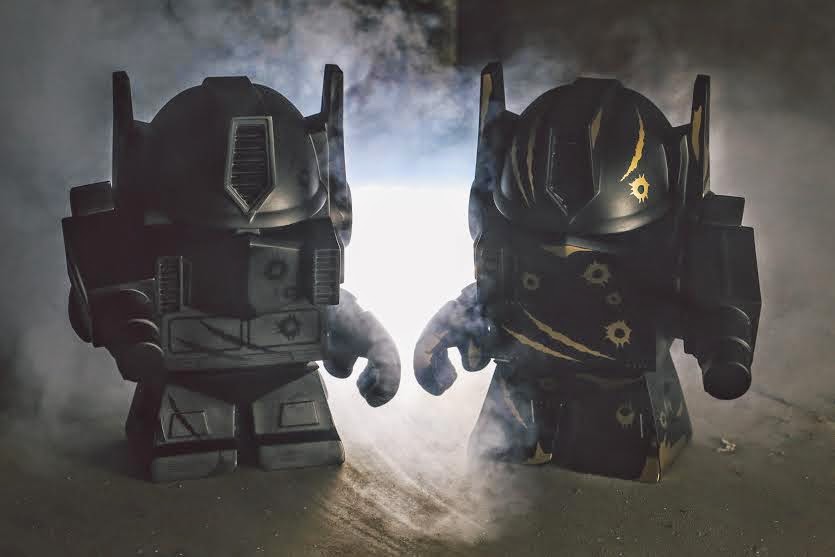 San Diego Comic-Con 2014 Exclusive Battle Damaged Optimus Prime 8” Transformers Vinyl Figures by The Loyal Subjects - Black on Black & Gold on Black