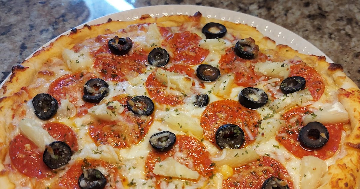 Pepperoni, olive, and pineapple pizza