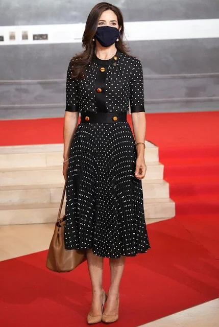 Crown Princess Mary wore a new polka dot pleated dress from Prada. French President Emmanuel Macron
