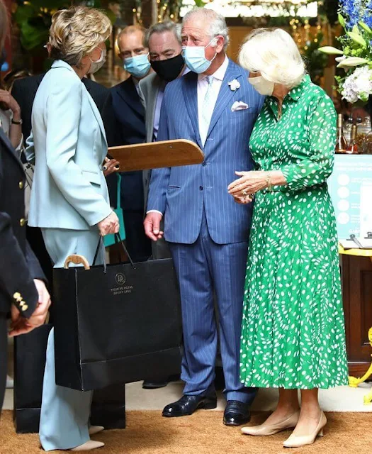 The Duchess wore a new ivy green floral print audrey drapery dota dress from Samantha Sung