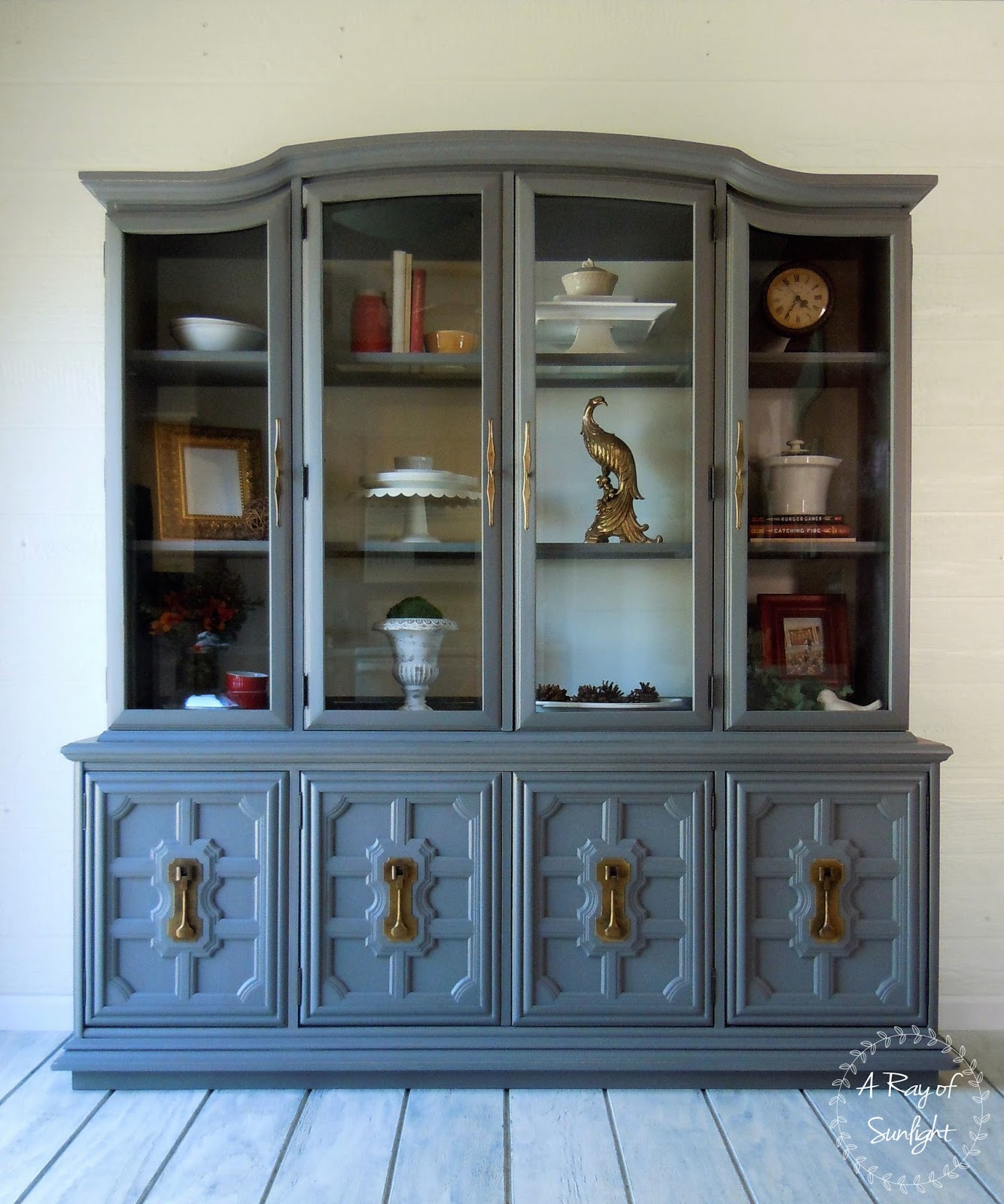 large gray painted hutch with white back