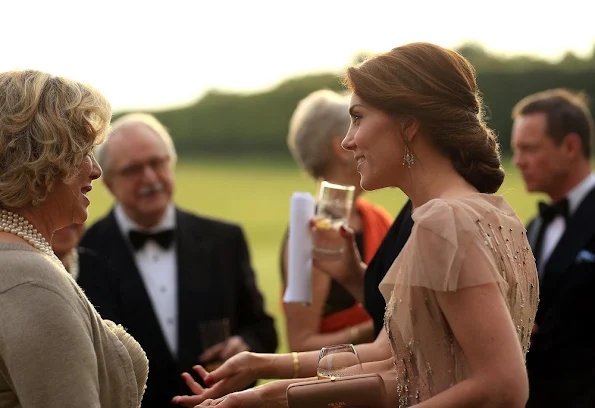 Prince William and Kate Middleton attended a gala charity dinner in support of East Anglia's Children's Hospices. Kate wore Jenny Packham gown