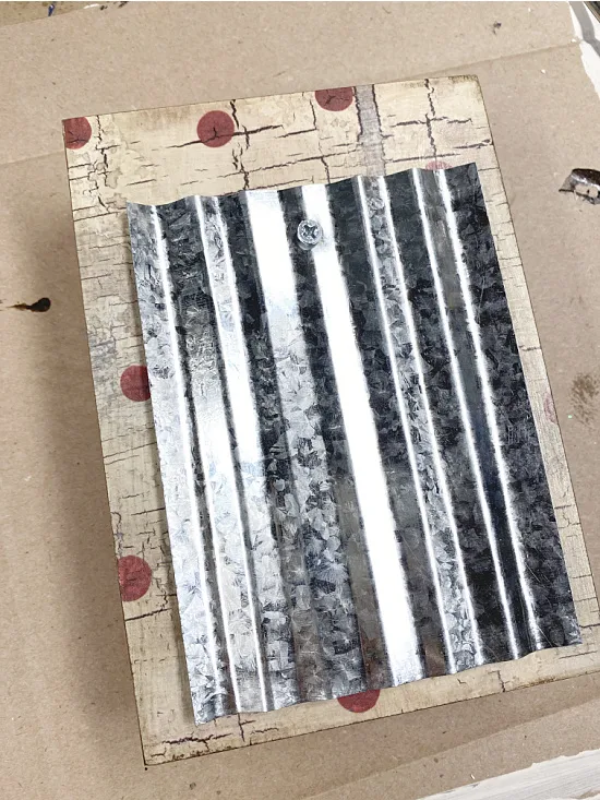 galvanized steel attached to box with a screw