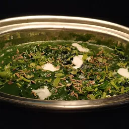 Serving Methi palak with fried cumin seeds and coriander leaves for methi palak recipe