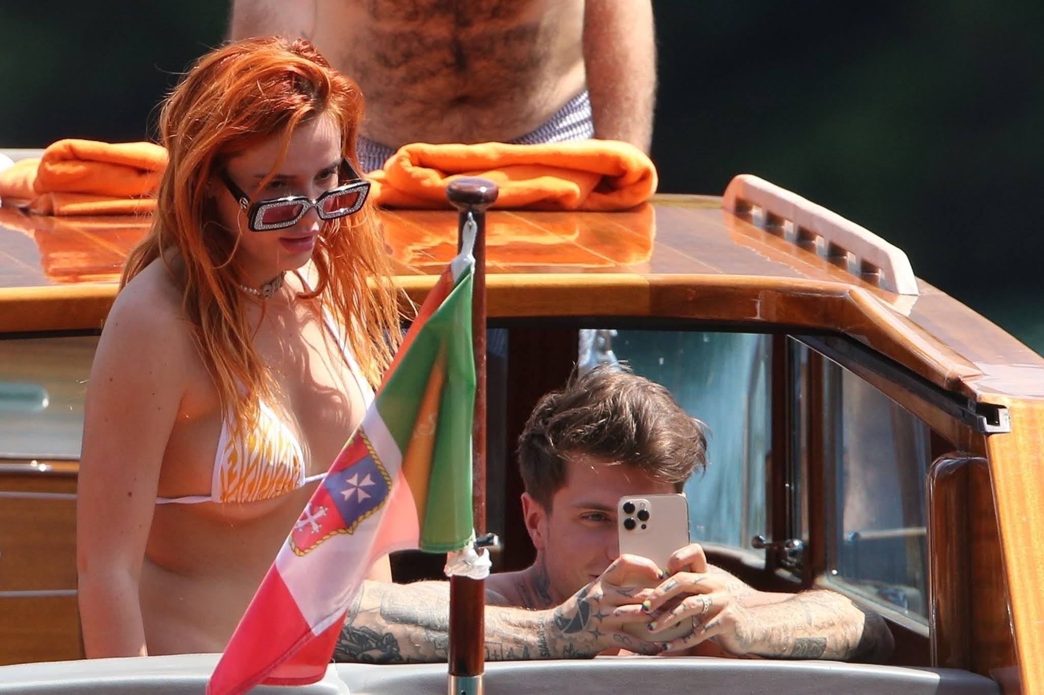 Bella Thorne sizzles in a tiny string bikini with fiance and pals in Italy