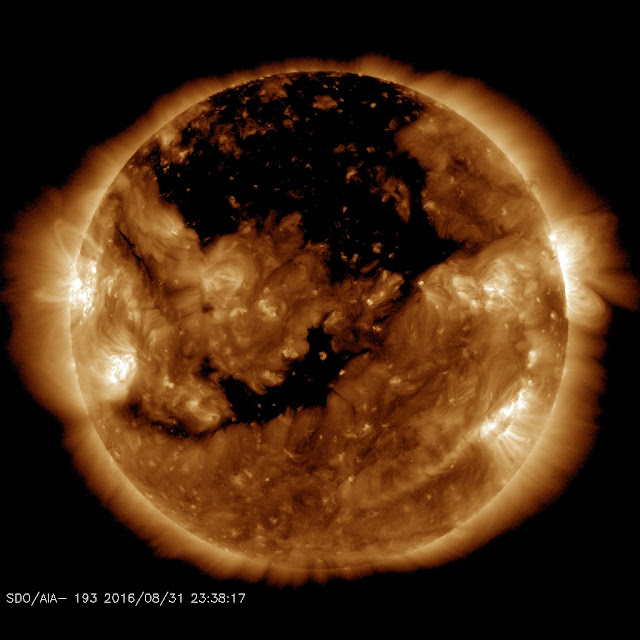 A monster coronal hole is facing Earth: Coronal holes thought to cause large quakes...Stay tuned  Coronalhole_sdo_blank%2B%25281%2529