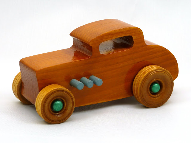Left Front - Wooden Toy Car - Hot Rod Freaky Ford - 32 Deuce Coupe - Pine - Amber Shellac - Metallic Green - Gray Left Front - Wooden Toy Car - Hot Rod Freaky Ford - 32 Deuce Coupe - Pine - Amber Shellac - Metallic Green - Gray