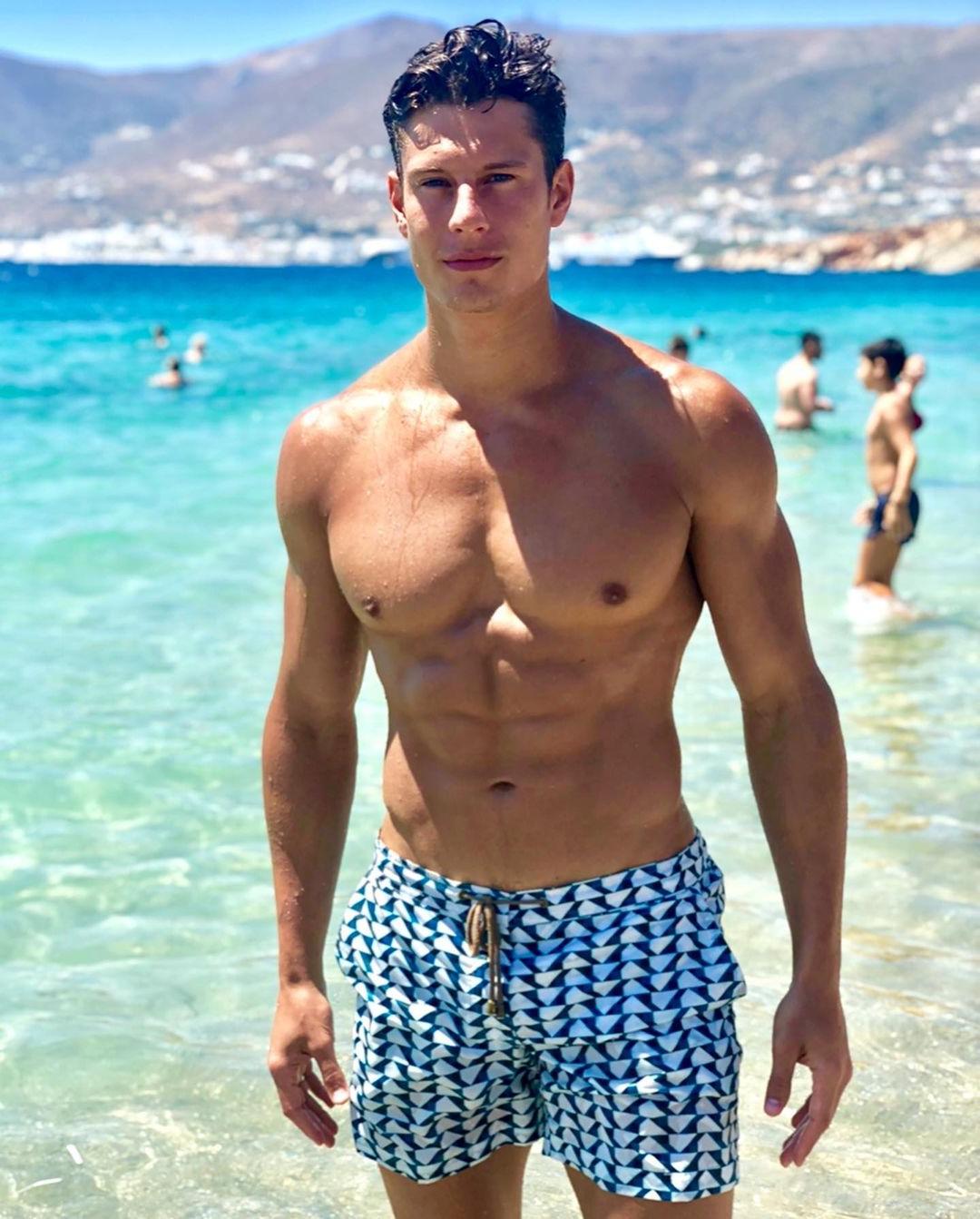 shirtless-fit-male-model-massive-muscular-pecs-abs-blue-ocean-summer-fun-young-hunk
