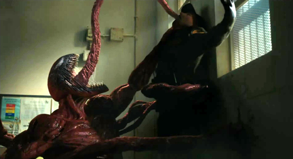 Carnage attacks a prison guard in VENOM: LET THERE BE CARNAGE.