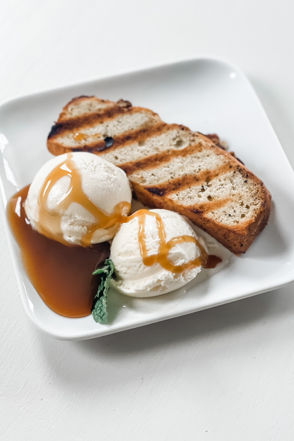 Grilled Banana Bread with Vanilla Ice Cream and Homemade Caramel Sauce