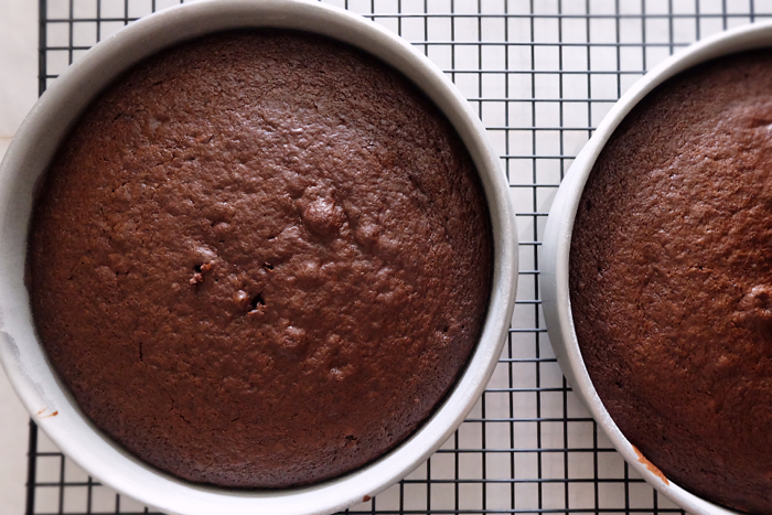baked chocolate cakes cooling on a rack