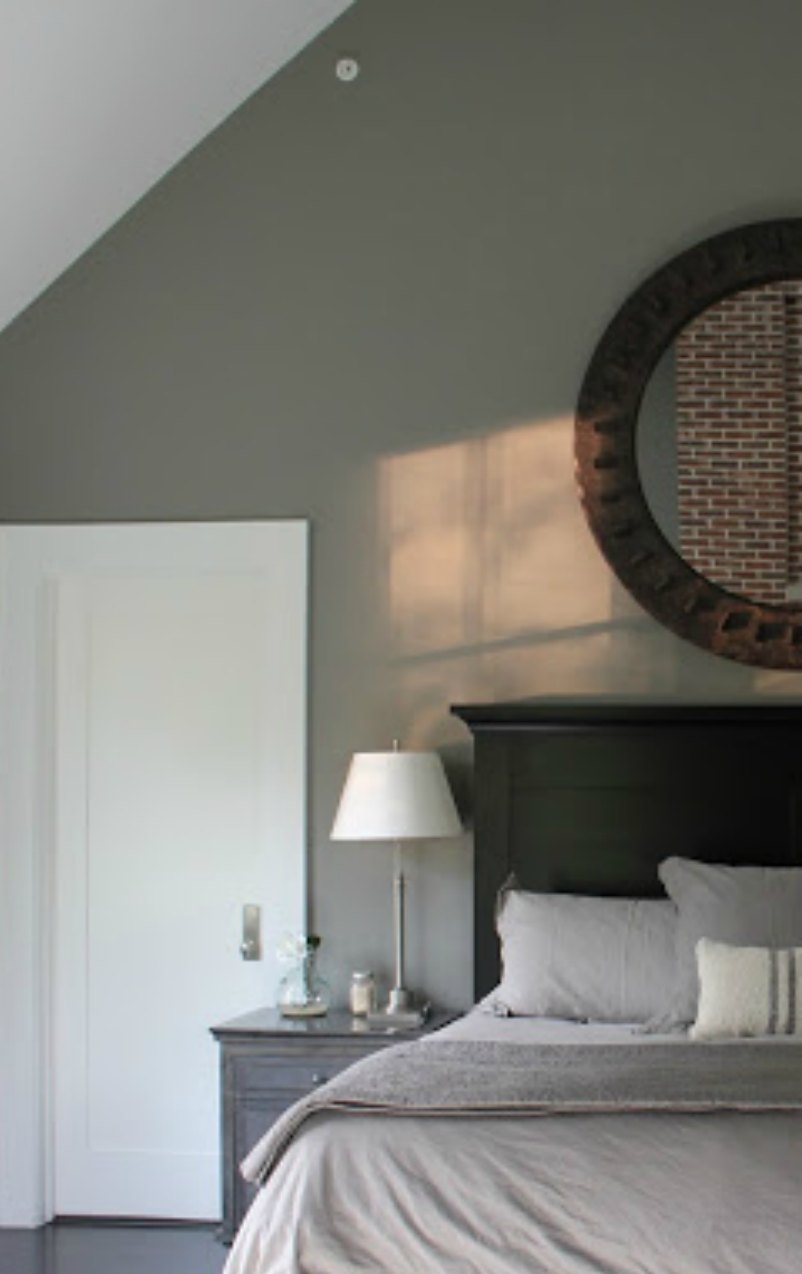 Grey and black masculine decor in a modern farmhouse bedroom - Hello Lovely Studio