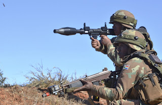 a south african soldier firing an rpg-7