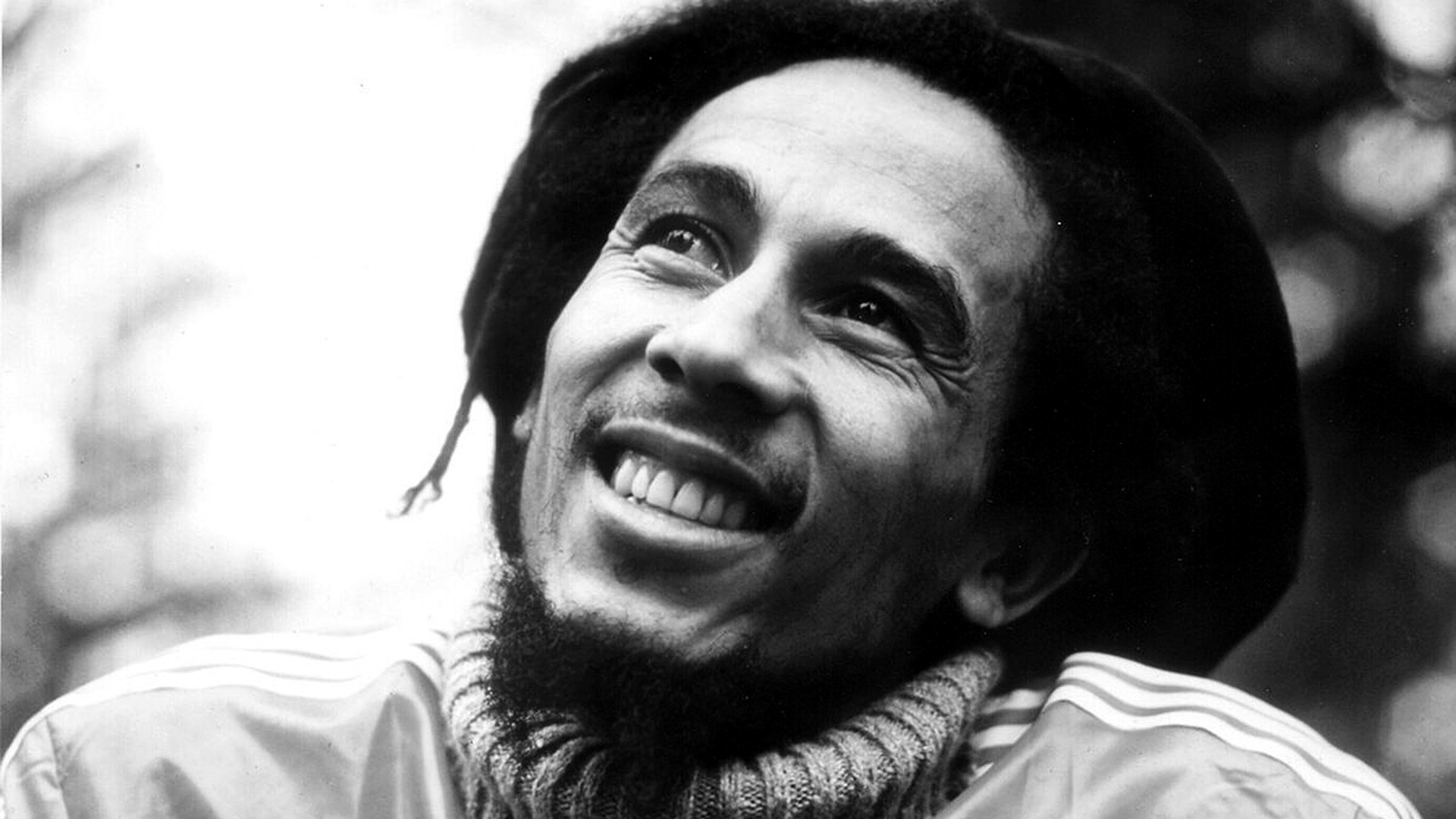 Bob Marley looking up and smiling