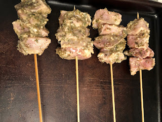 pork kabobs on pan ready for baking