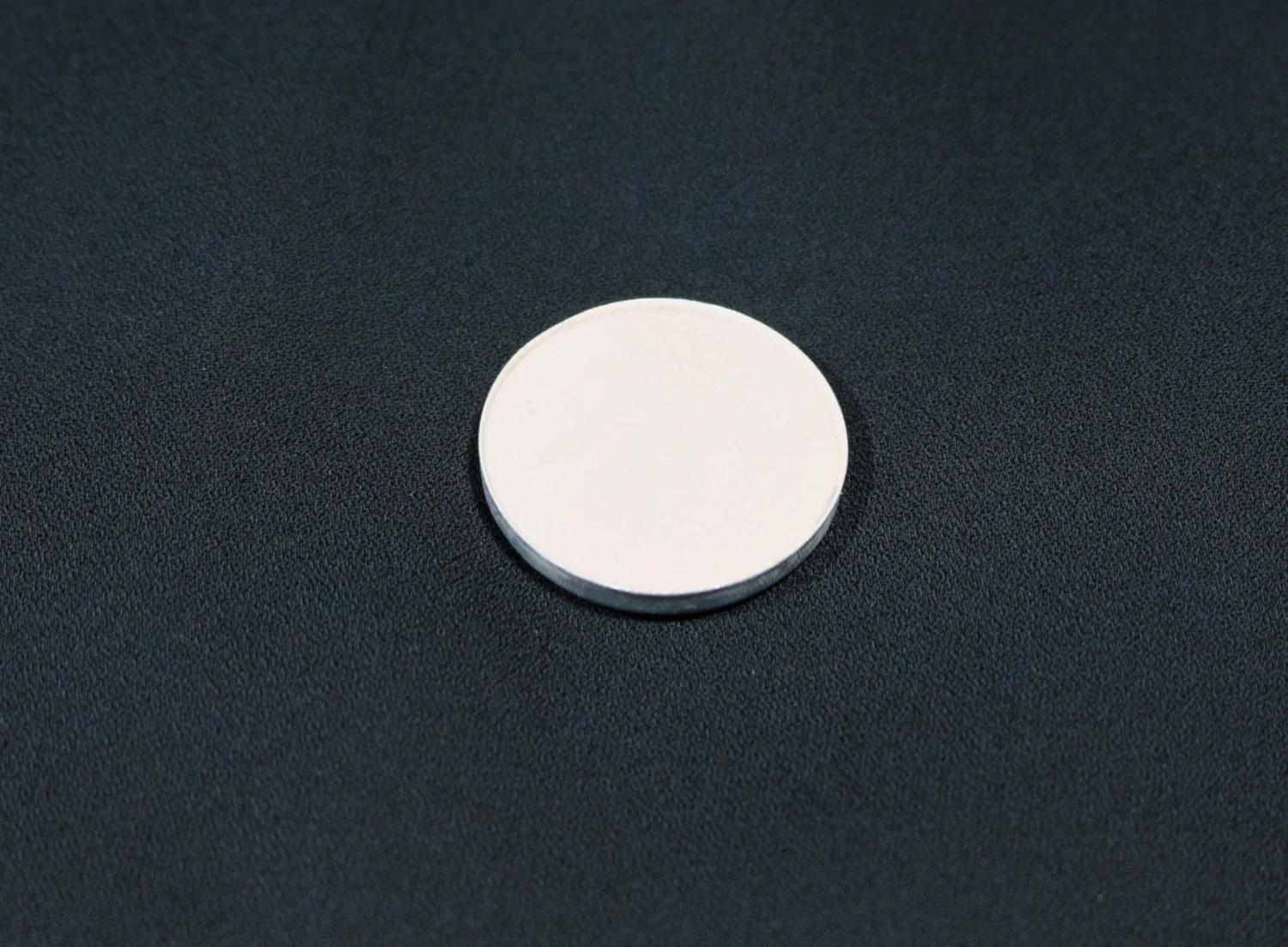 macro close-up of malt single eyeshadow by mac cosmetics on black background