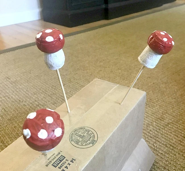 Painting recycled corks for free mushrooms for planters