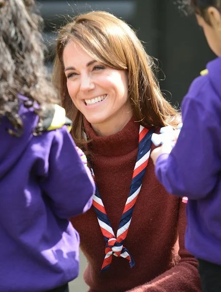 Kate Middleton is wearing her J Crew Mockneck sweater and Chloe boots