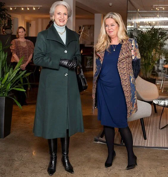 Princess Benedikte wore a green wool cashmere coat, and blue cashmere sweater, and gold diamond necklace. The Princess wore black leather boots