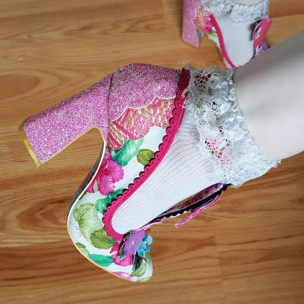 close up wearing pink flamingo floral shoes with ankle socks