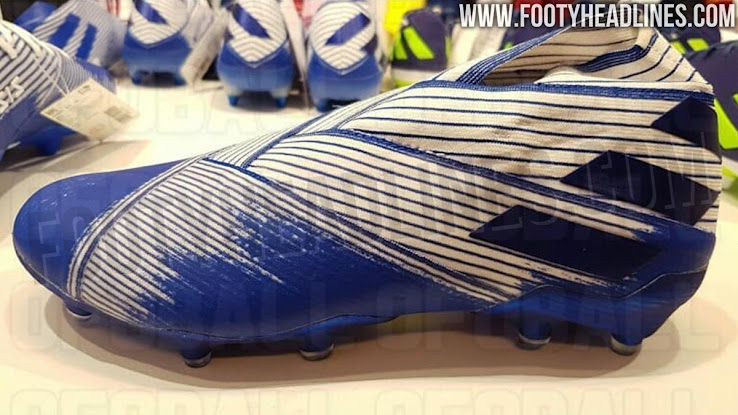 white and blue adidas boots