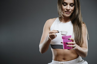 Woman making protein shake