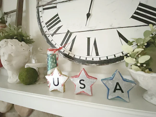 USA stars on a mantel with a clock