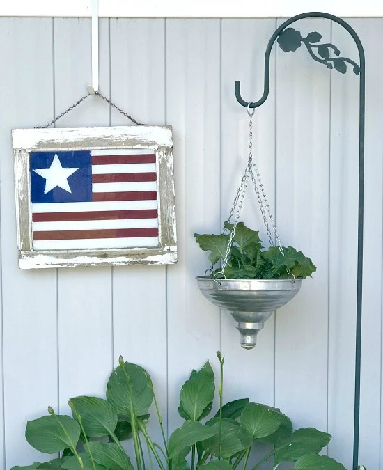 Painting an American flag on a chippy window for Fourth of July