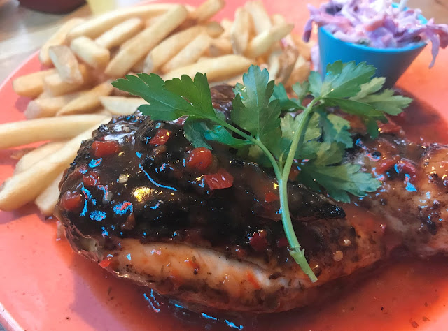 blazing bird in peri peri sauce with fries and slaw 