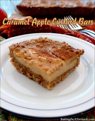 Caramel Apple Custard Bars feature and oat crust and a custard center with apples and caramel. The flavors of Fall in a dessert bar. | Recipe developed by www.BakingInATornado.com | #recipe #bake
