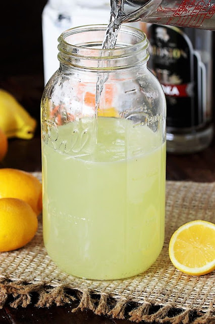 Mixing Homemade Hard Lemonade with Vodka Image