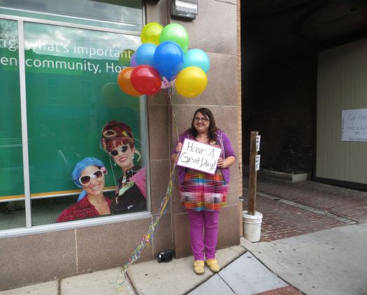 Handing Balloons To Strangers